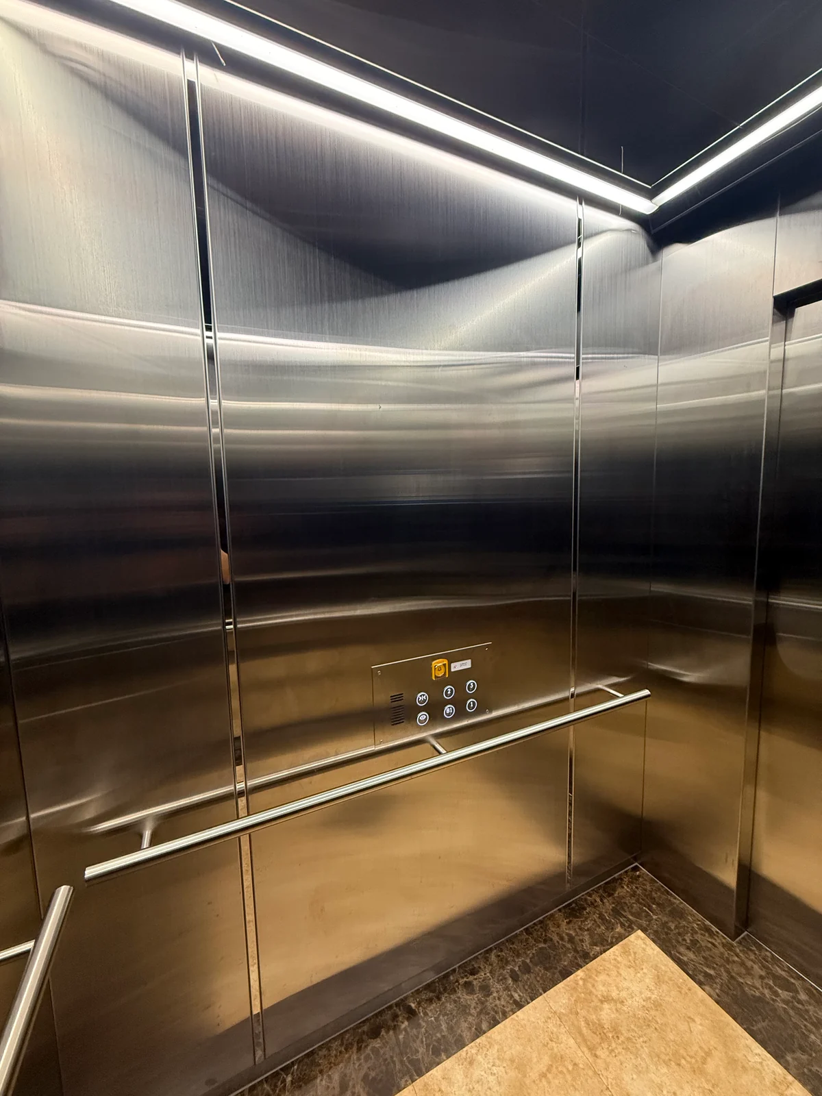 Gwangju Bandabi Sports Center · Lift 1 — elevator wall and handrail detail